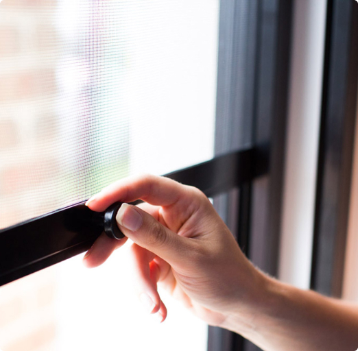 hand pulling down fly screen