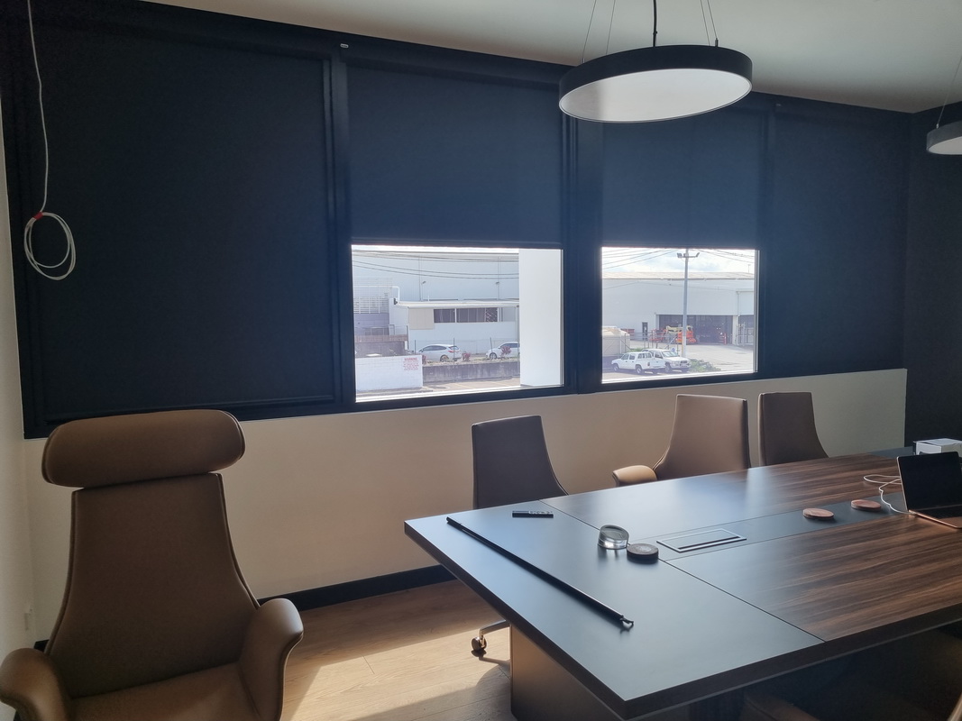partially open blackout blinds in office