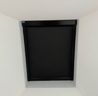 skylight covered with black window blind