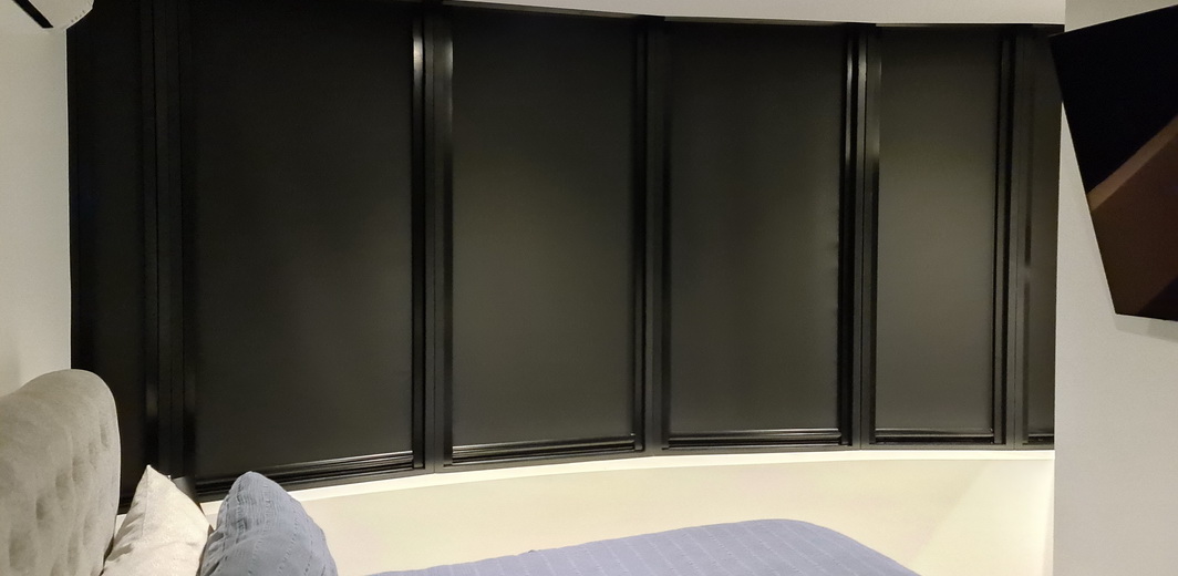bedroom windows covered by blackout blinds
