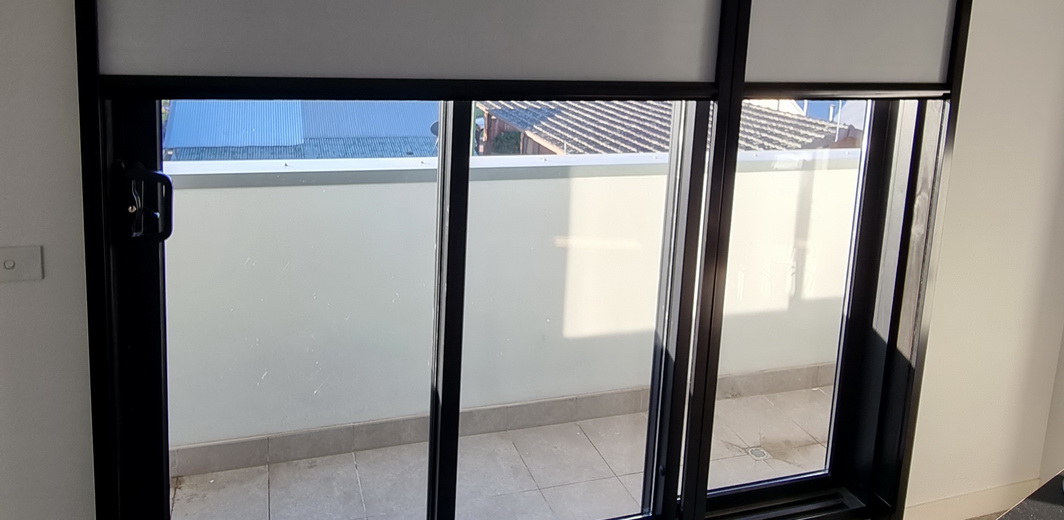 doors partially covered by white blind