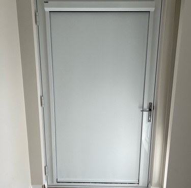 white door blind covering door completely