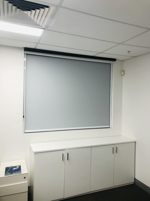 closed retractable blinds in office space
