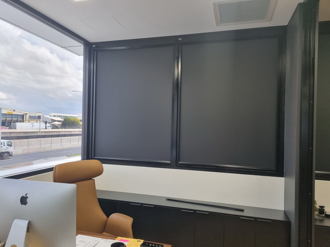 closed retractable blinds in office space