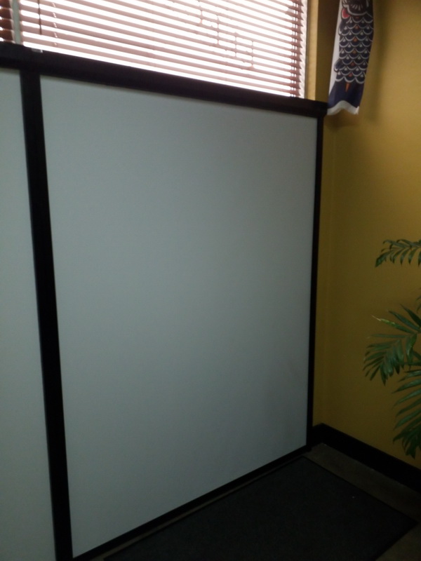 closed retractable blinds in office space