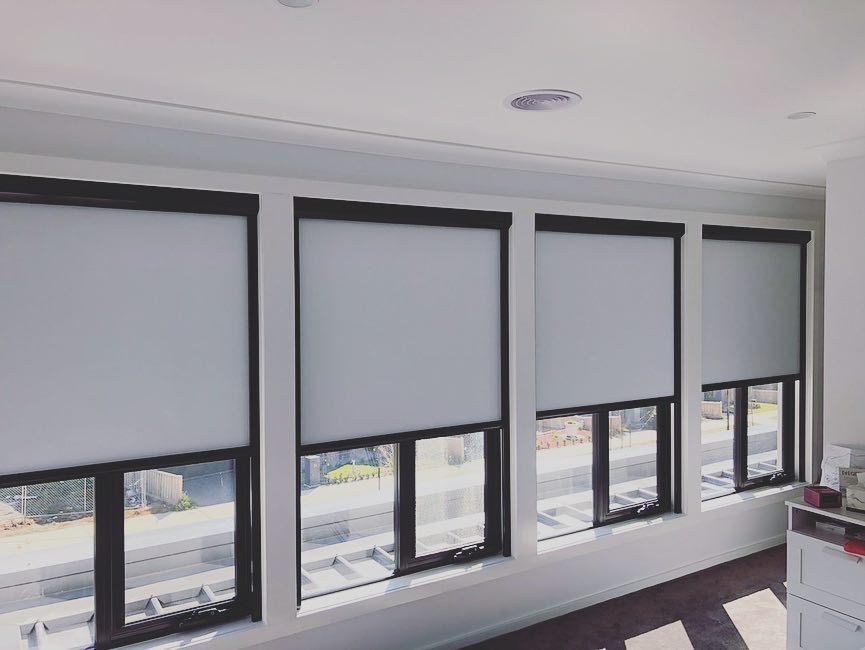partially open retractable blinds in office space