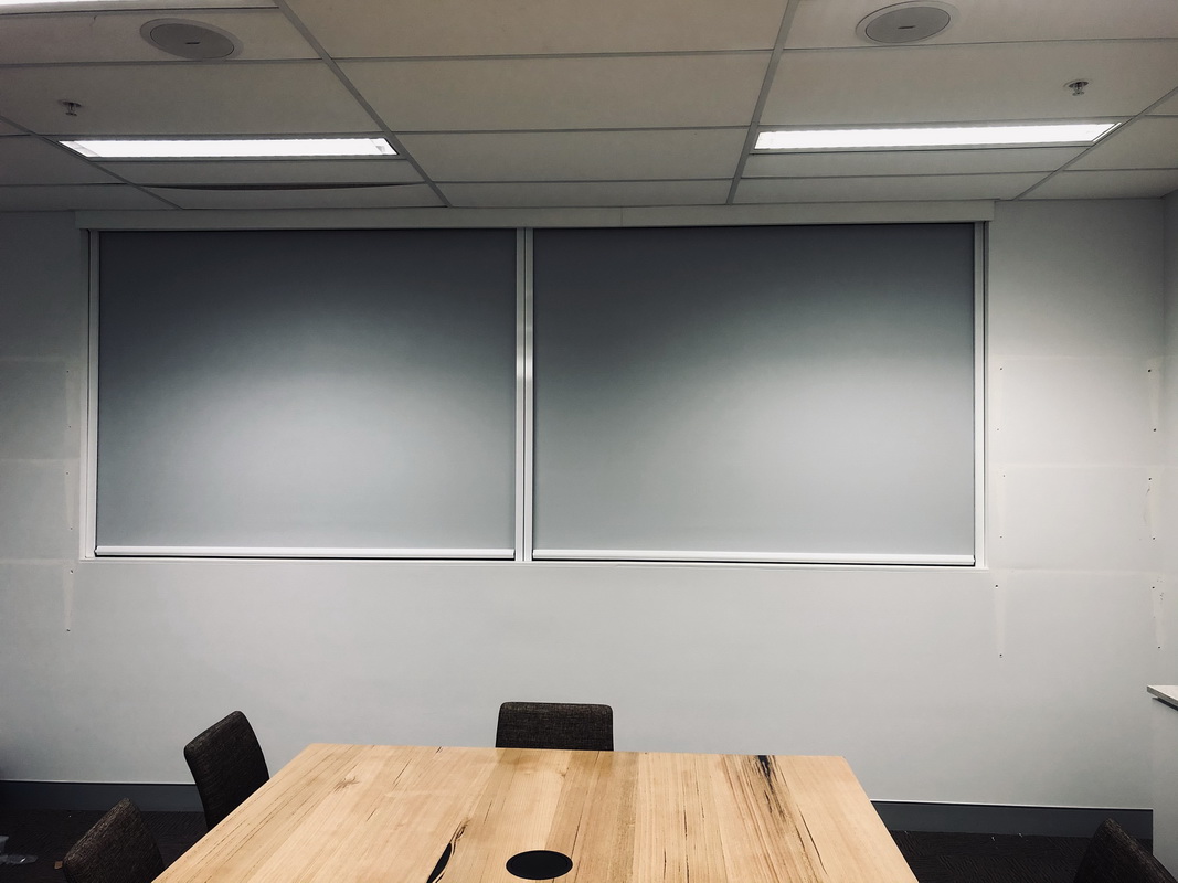closed retractable blinds in office space