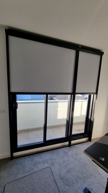 partially open retractable blinds on door