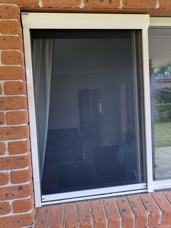 retractable fly screen on living room window