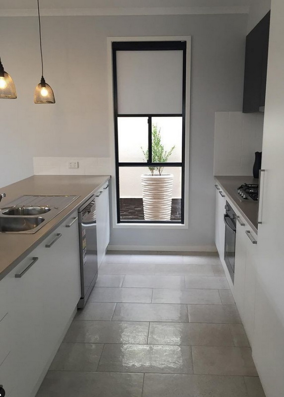 partially open retractable blinds in kitchen