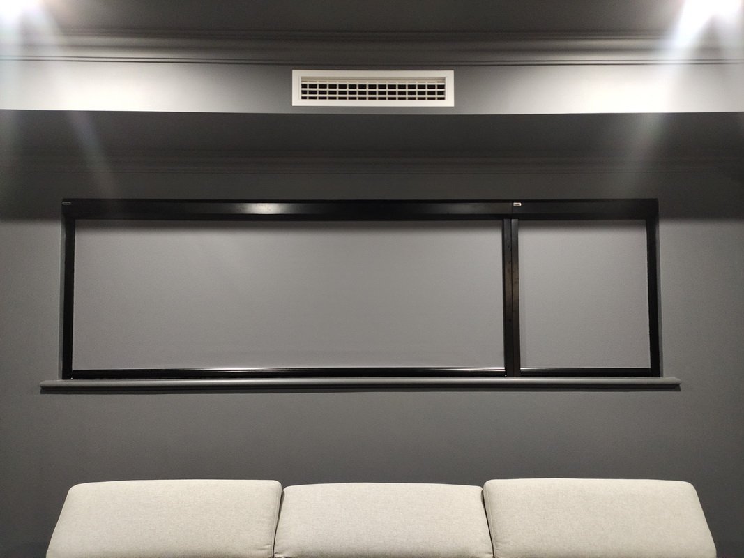 closed retractable blinds in theatre room