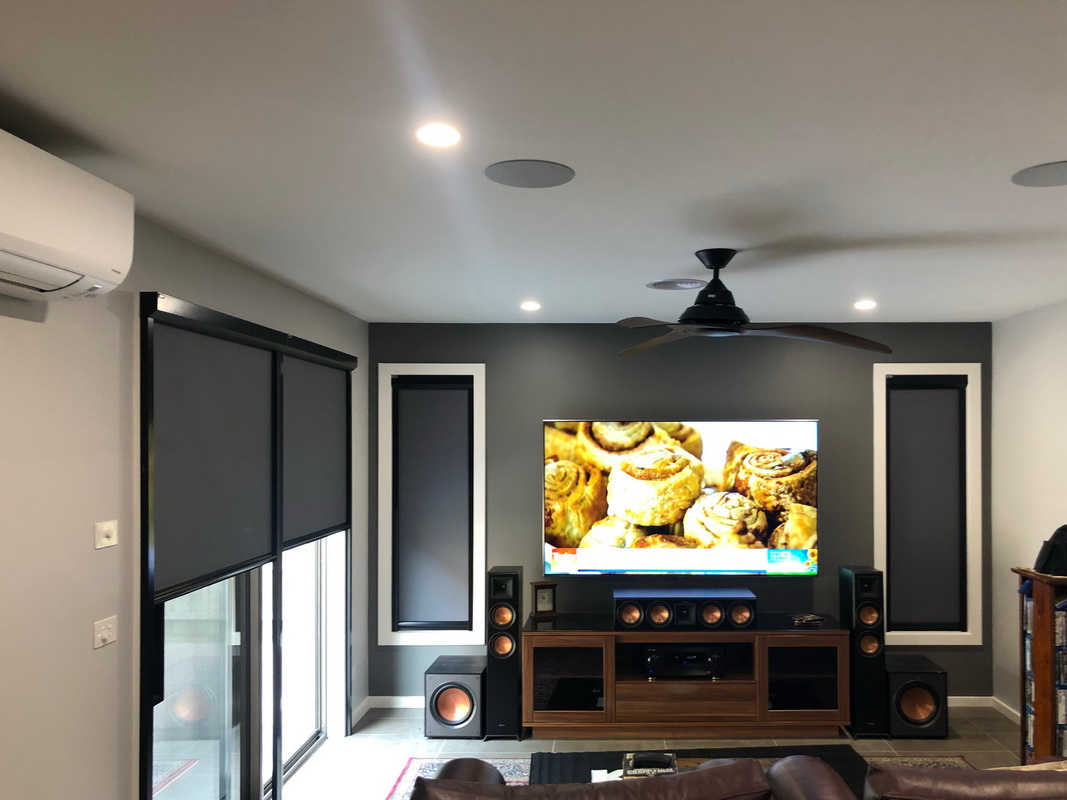 partially open retractable blinds in theatre room
