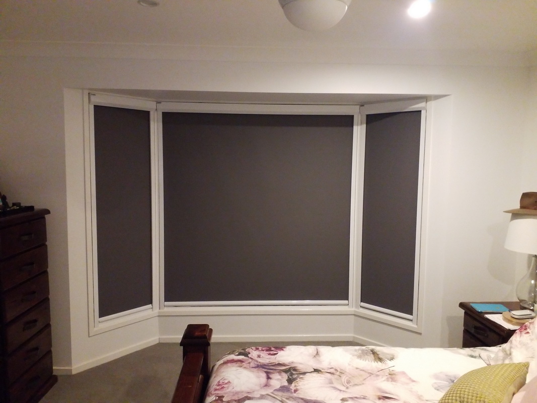 closed retractable window blinds in bedroom