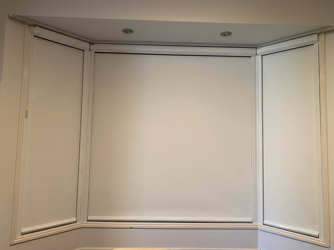 closed retractable window blinds in bedroom