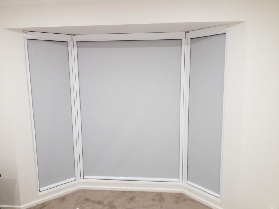 closed retractable window blinds in bedroom