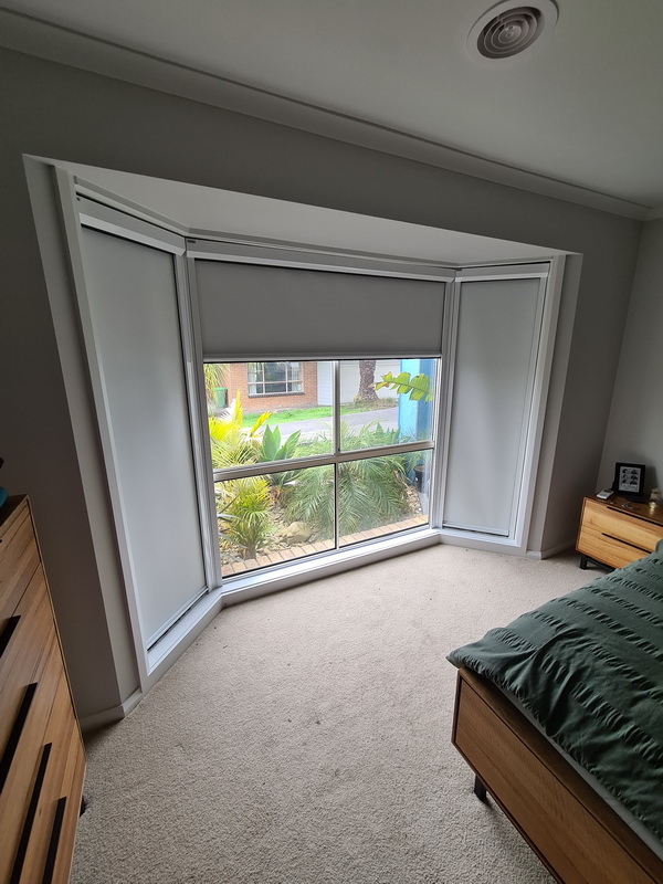 open retractable window blinds in bedroom