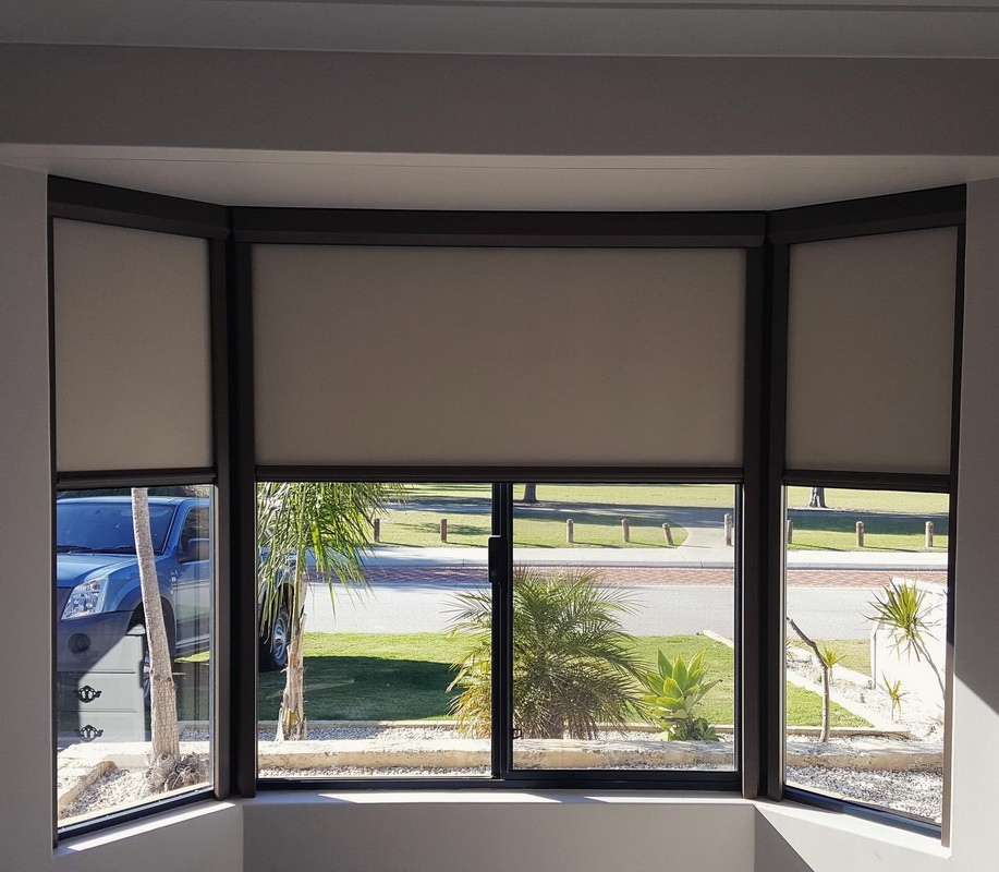 partially open retractable window blinds in living room