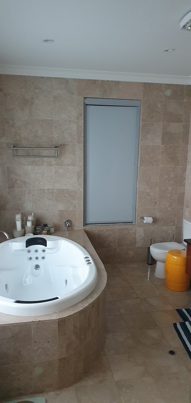 closed retractable blind in bathroom