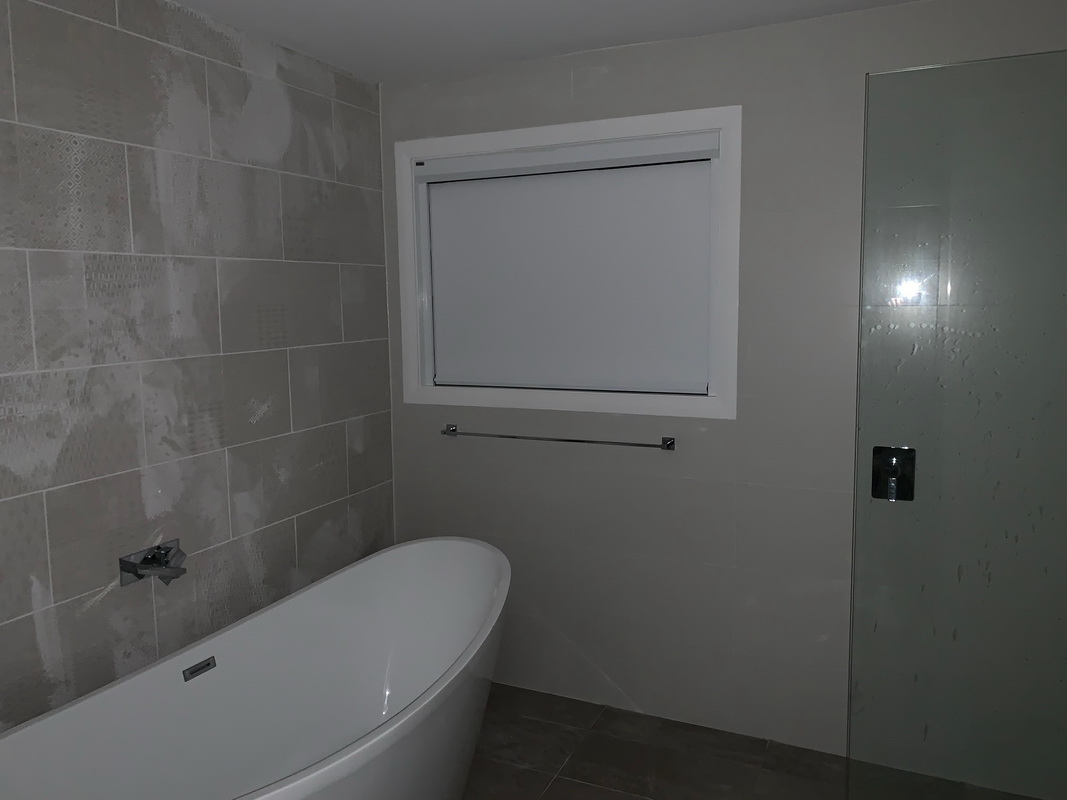 closed retractable blind in bathroom