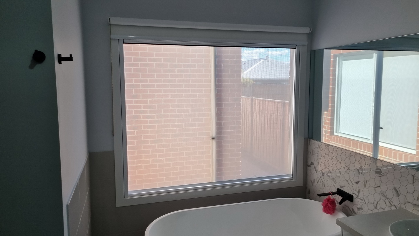open retractable blind in bathroom
