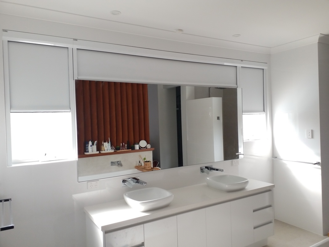 partially open retractable blinds in bathroom