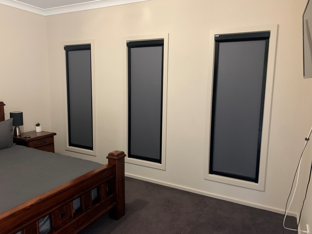 closed retractable blinds in bedroom