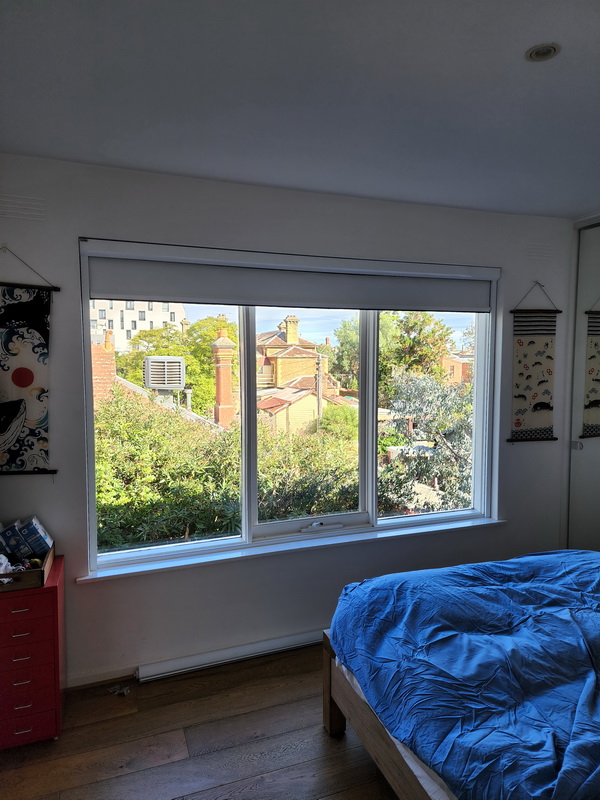 open retractable blind in bedroom