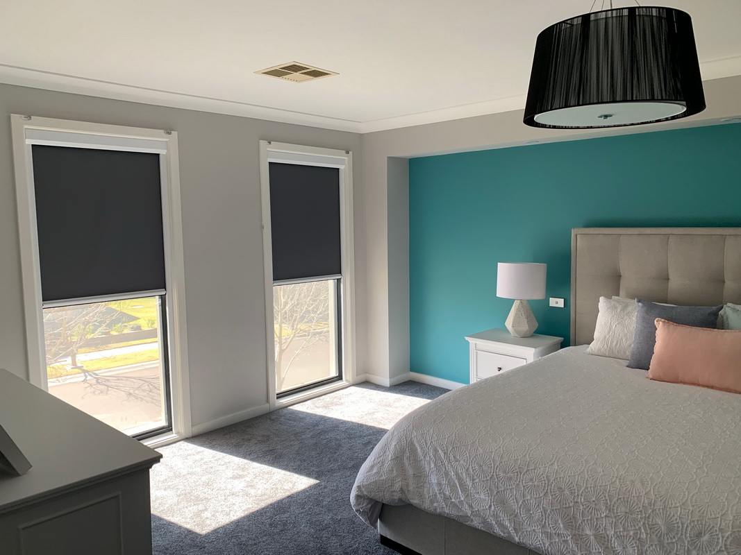 partially open retractable blinds in bedroom