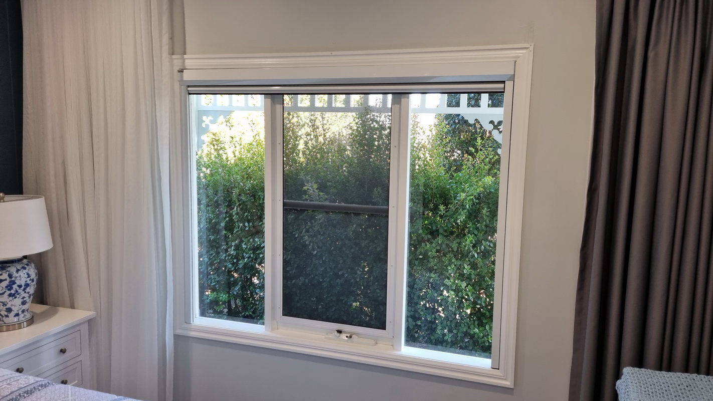 open retractable blind in bedroom