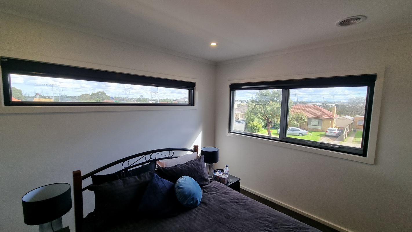 open retractable blinds in bedroom