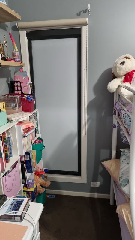 closed retractable blind in bedroom