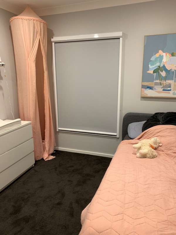 closed retractable blind in bedroom