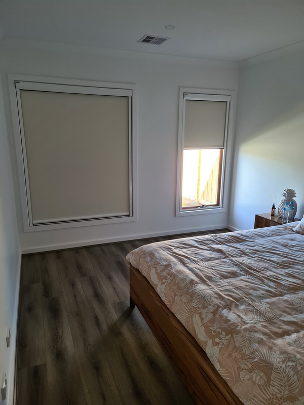 closed retractable blinds in bedroom