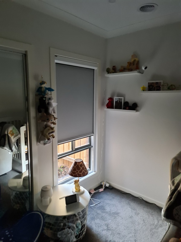 nursery with partially open retractable blinds