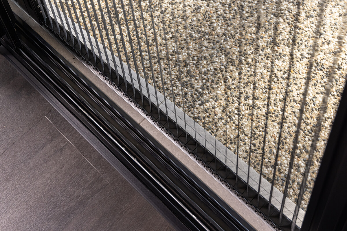 Sliding glass door with a retractable metal screen