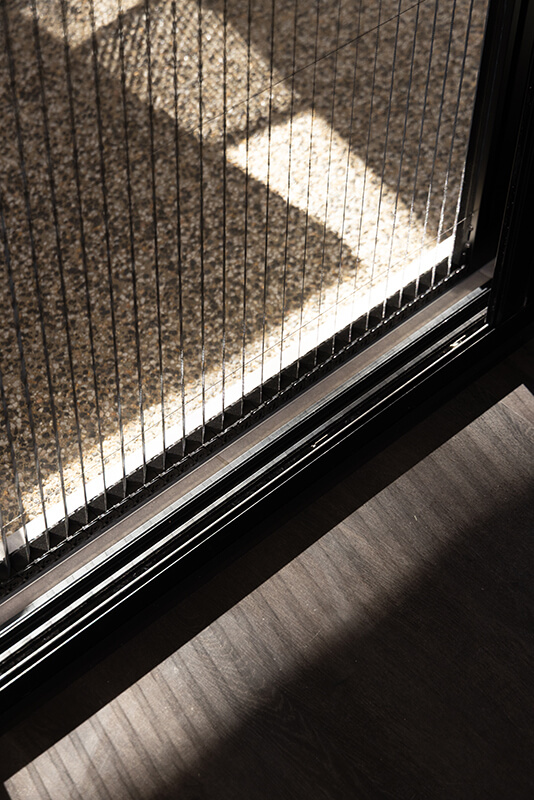 Sliding glass door with a retractable metal screen