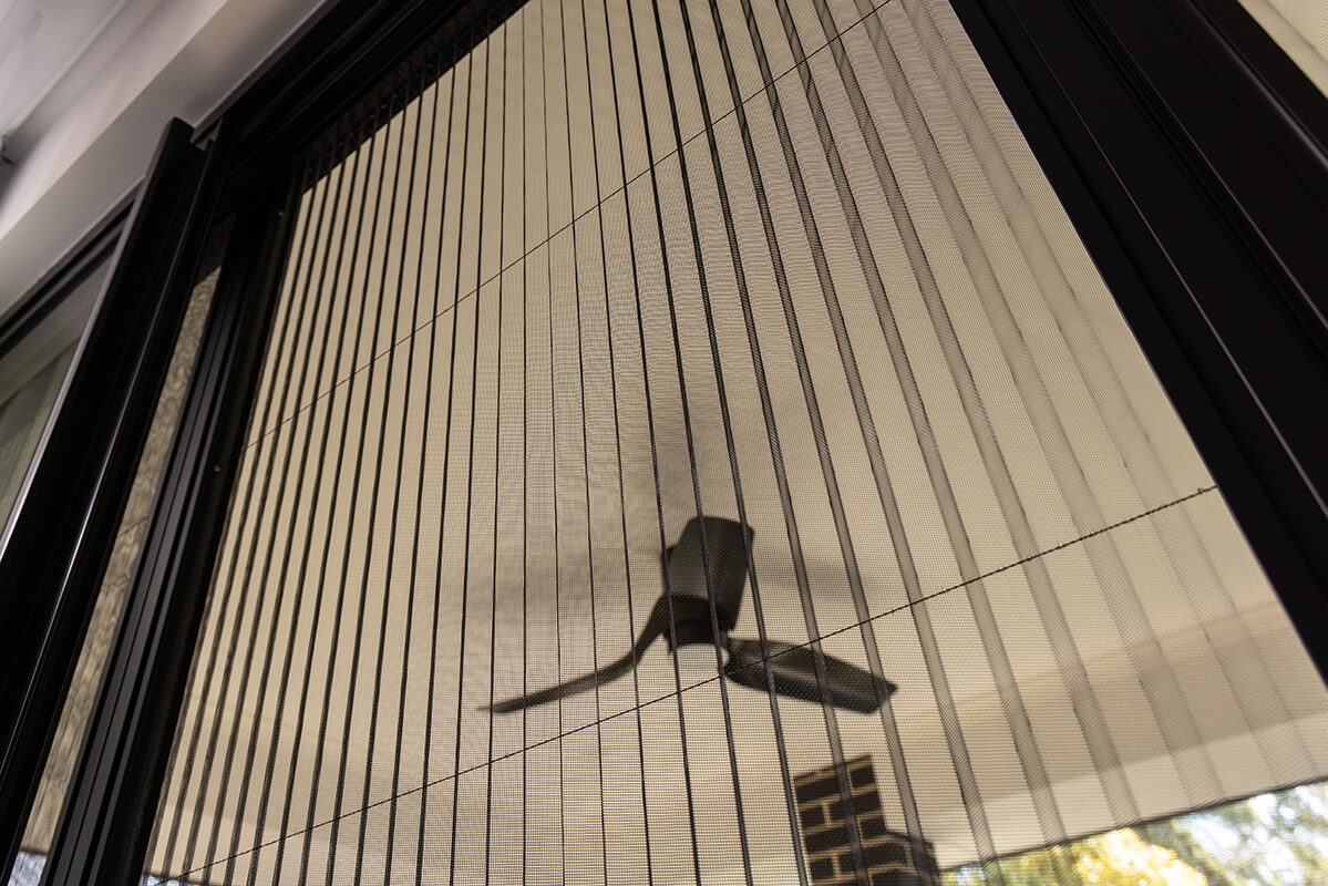 Sliding glass door with a retractable metal screen